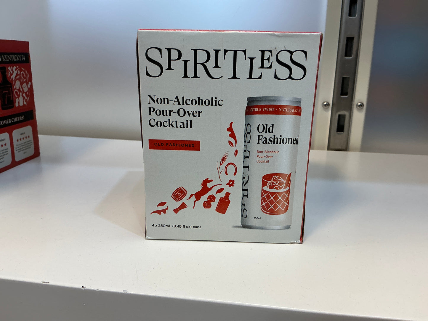 Box of Spiritless Old Fashioned non-alcoholic pour-over cocktail on a white surface.