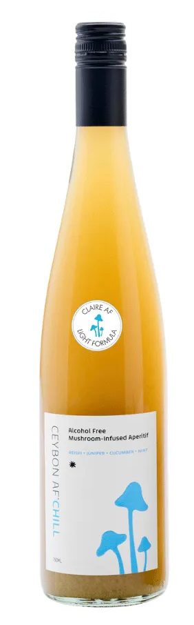 Two bottles of alcohol-free wine with mushroom illustrations on labels against a white background