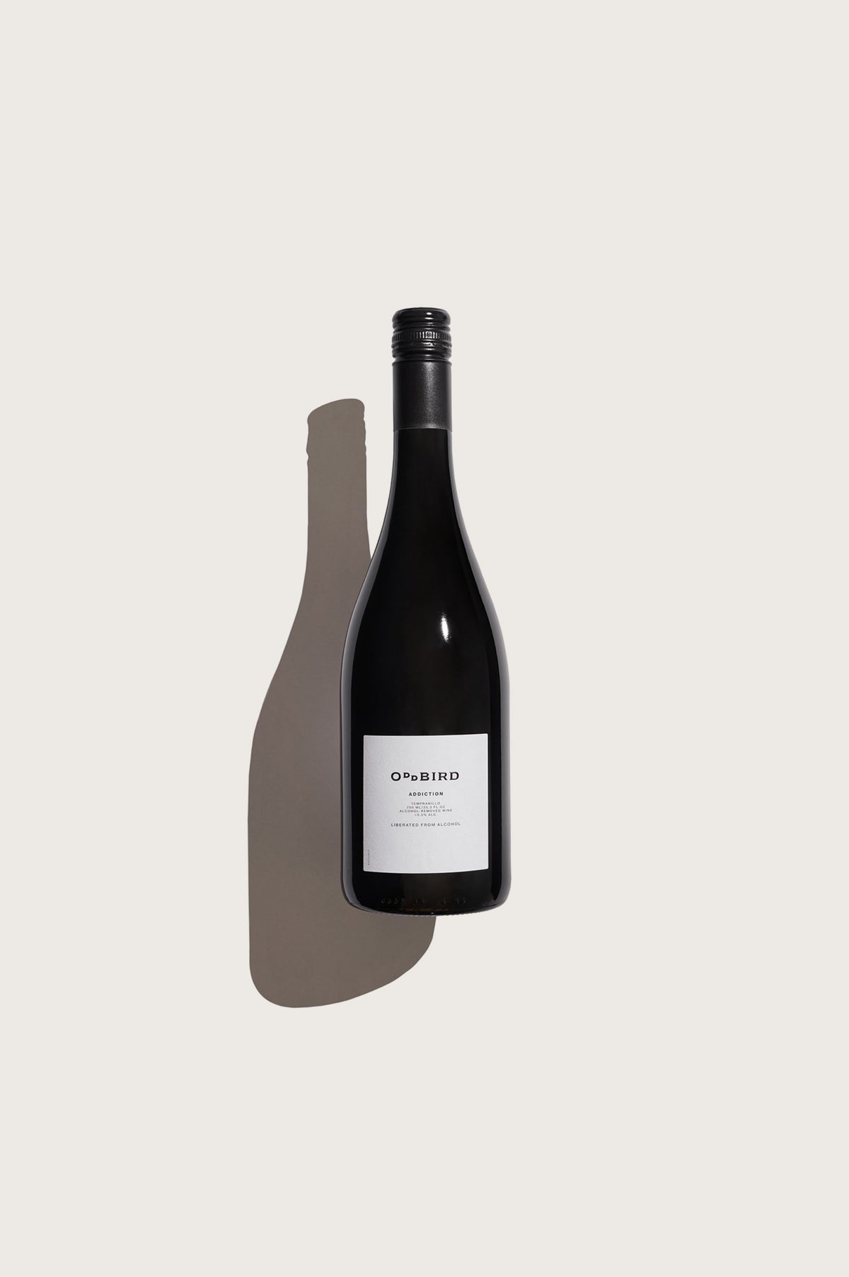 Wine bottle with a label on a light gray background