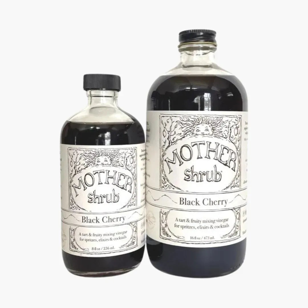 Two bottles of Mother Shrub Black Cherry on a white background