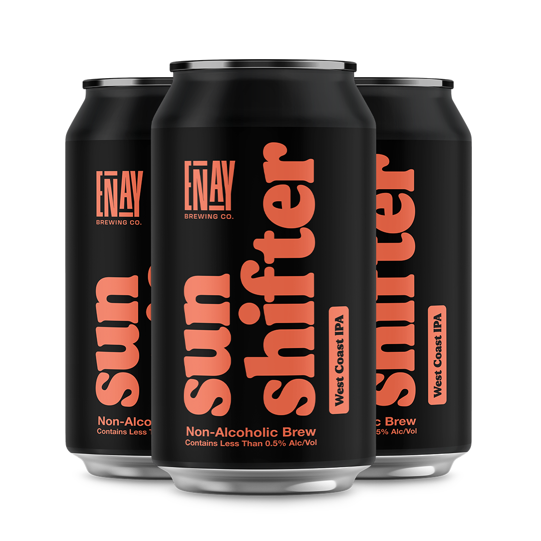 Three black cans of Enay Brewing Co. Sun Shifter Non-Alcoholic Brew on a white background
