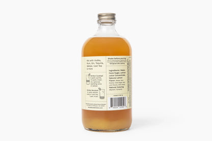 Bottle of liquid with a label on a white background