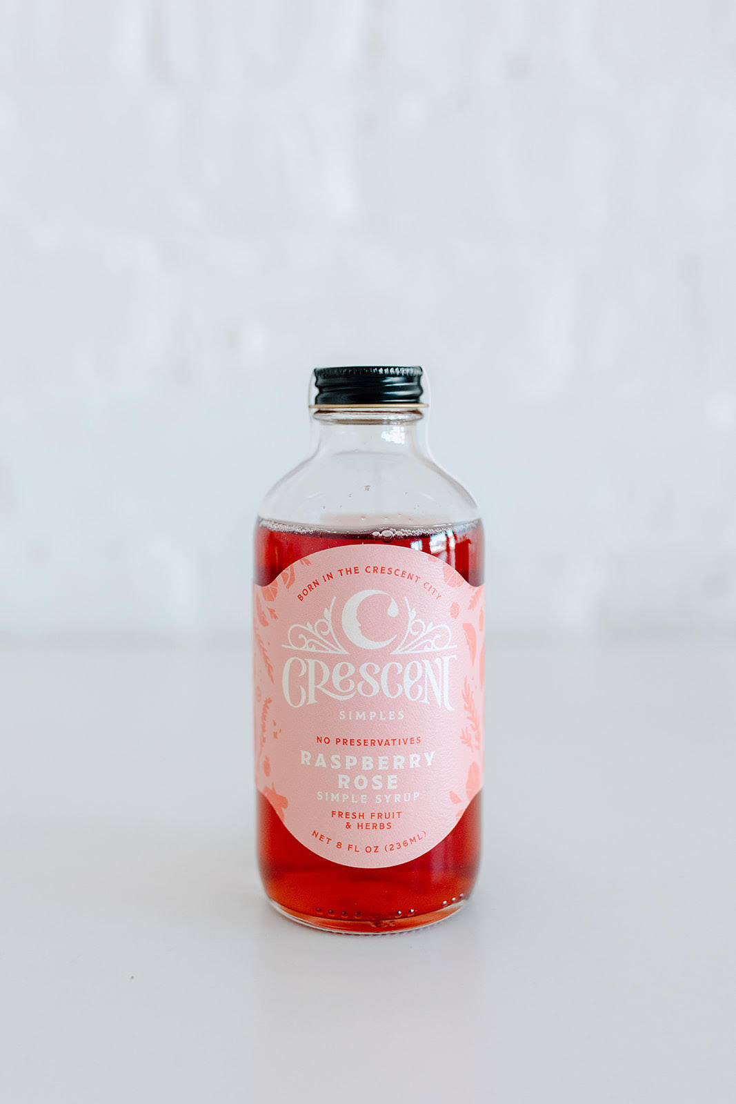 Bottle of 'Crescent' syrup on a white background