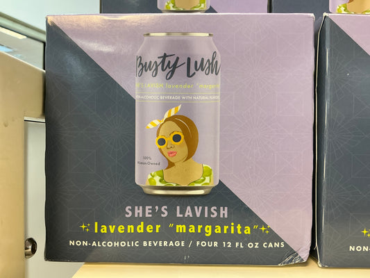 She's Lavish non-alcoholic beverage can packaging on a shelf