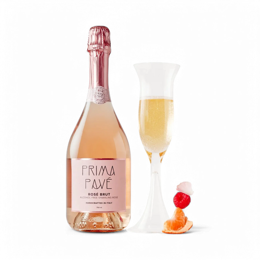 Bottle of Prima Pave Rosé Brut with a glass of champagne on a white background