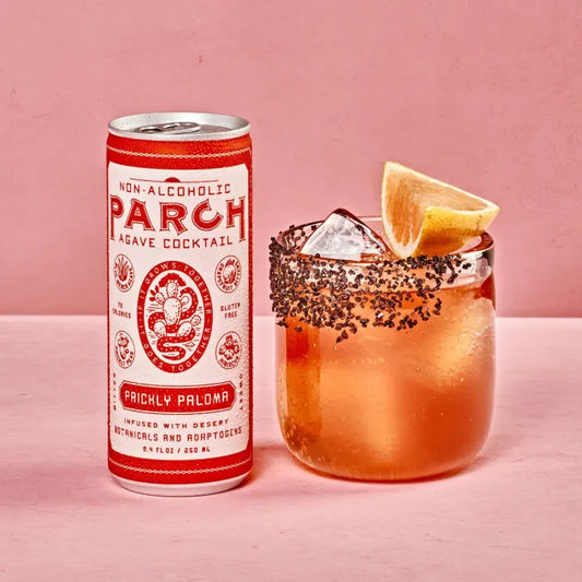 Parch Prickly Paloma non-alcoholic cocktail can with a glass of the cocktail on a pink background