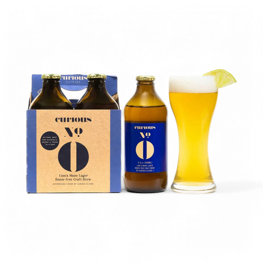 Curious No 0 beer bottle with packaging and a glass of beer on a white background
