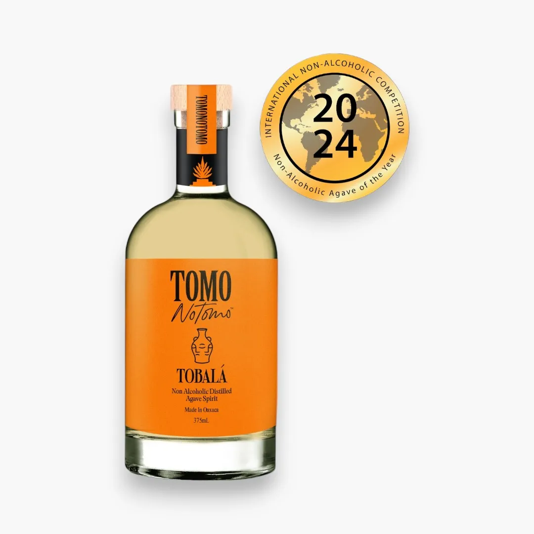 Bottle of TOMO Notions Tobala non-alcoholic agave with an award badge on a white background