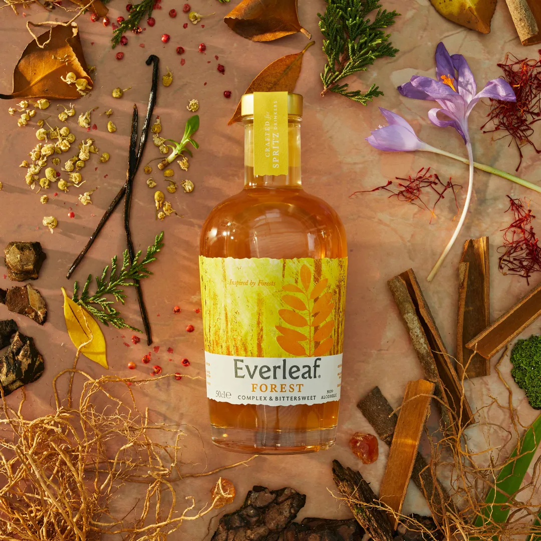 Bottle of Everleaf Forest on a decorative background with natural elements