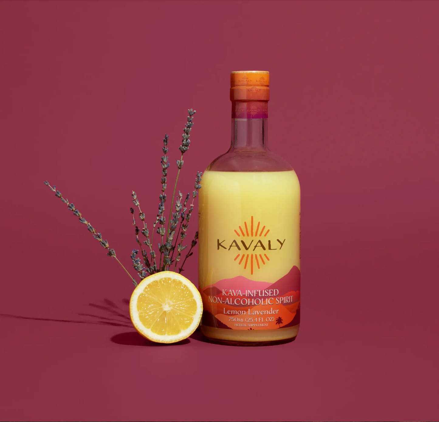 Bottle of Kavaly lemon lavender spirit with a lemon and lavender on a red background