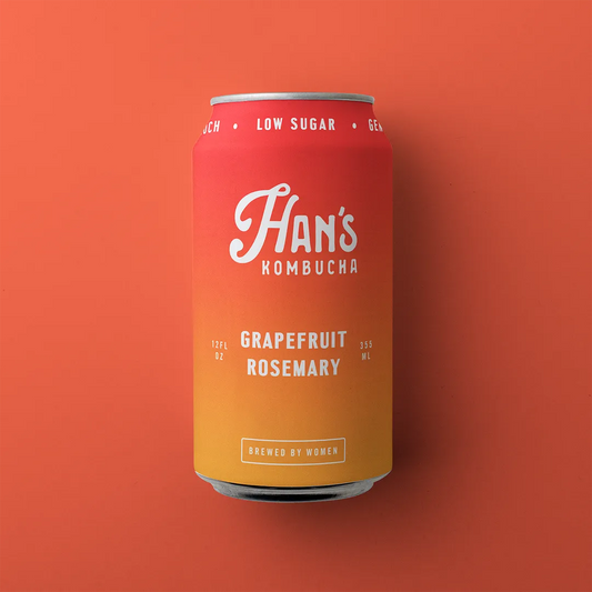 Red can of Han's Kombucha with grapefruit and rosemary flavor on an orange background