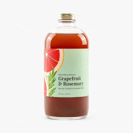 Bottle of Grapefruit & Rosemary mixer with a label on a white background