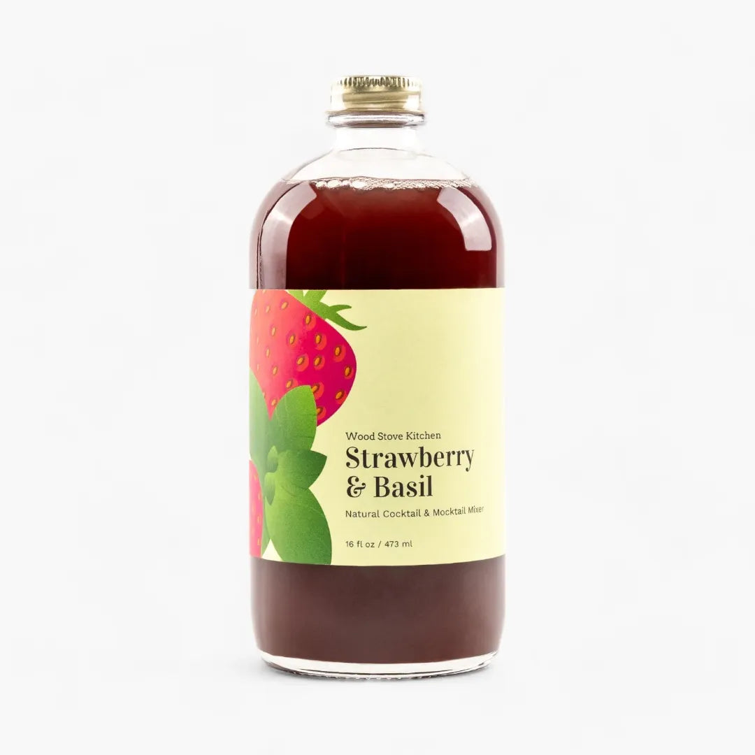 Bottle of Strawberry & Basil mixer with a label on a white background