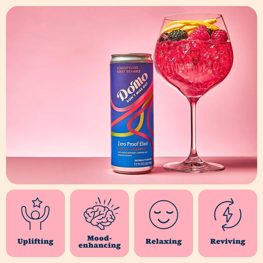 Domo zero proof elixir can with a pink cocktail on a pink background