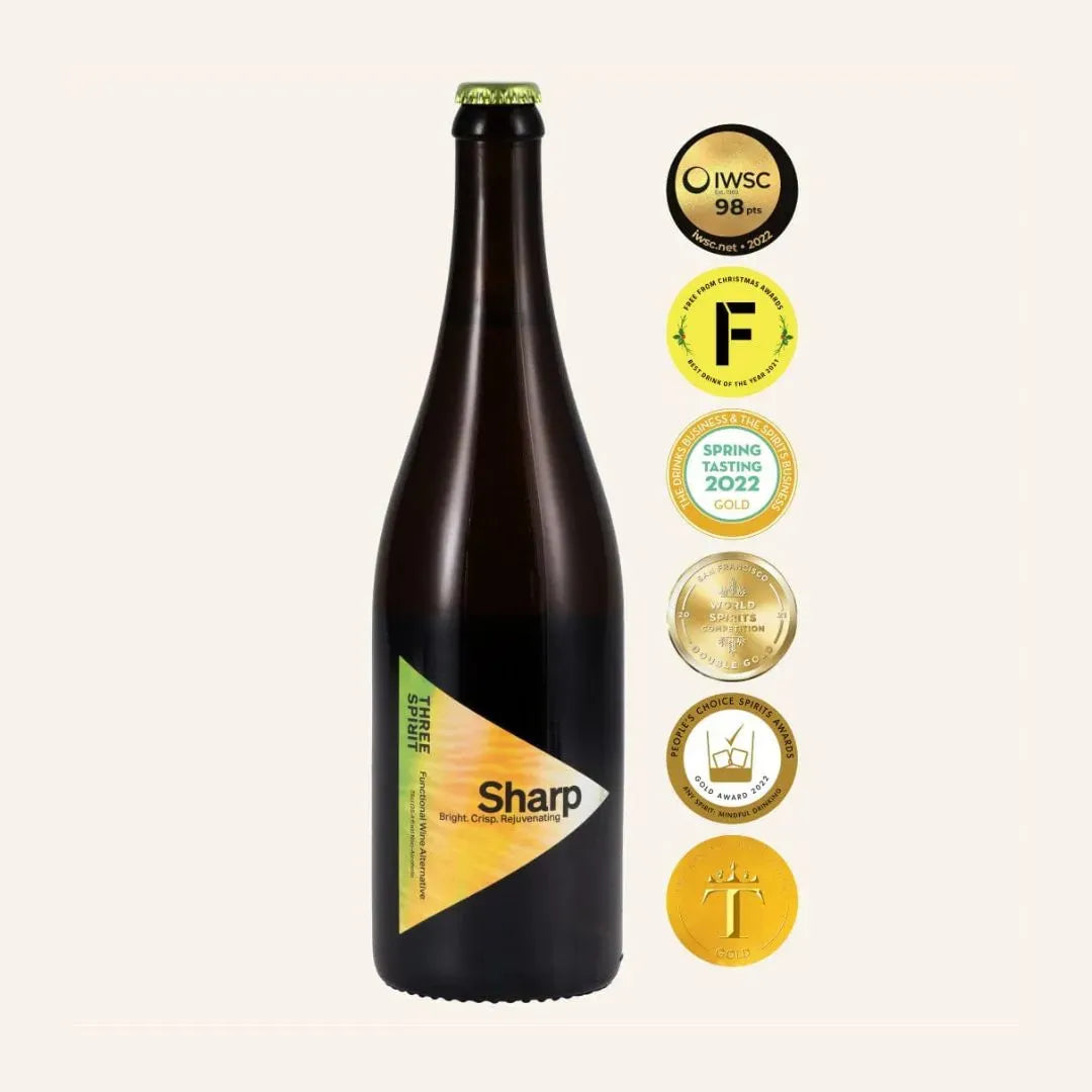Bottle of Sharp beer with multiple awards on a white background