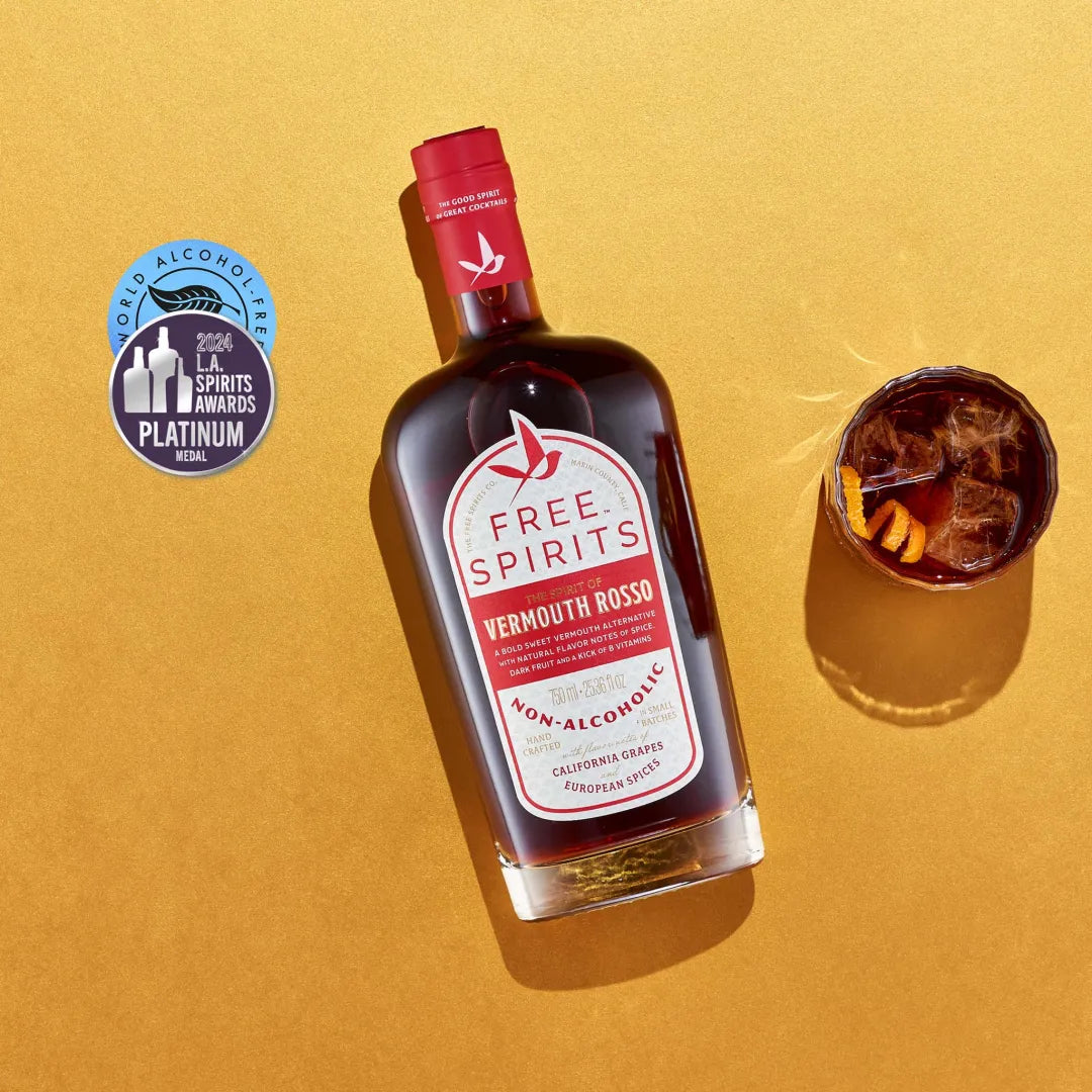 Bottle of Free Spirits Vermouth Rosso on a yellow background with a cocktail and award badge.