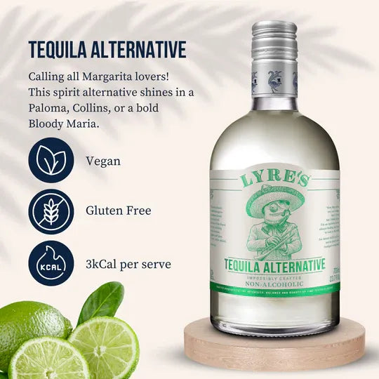 Lyre's Tequila Alternative bottle with lime slices on a white background
