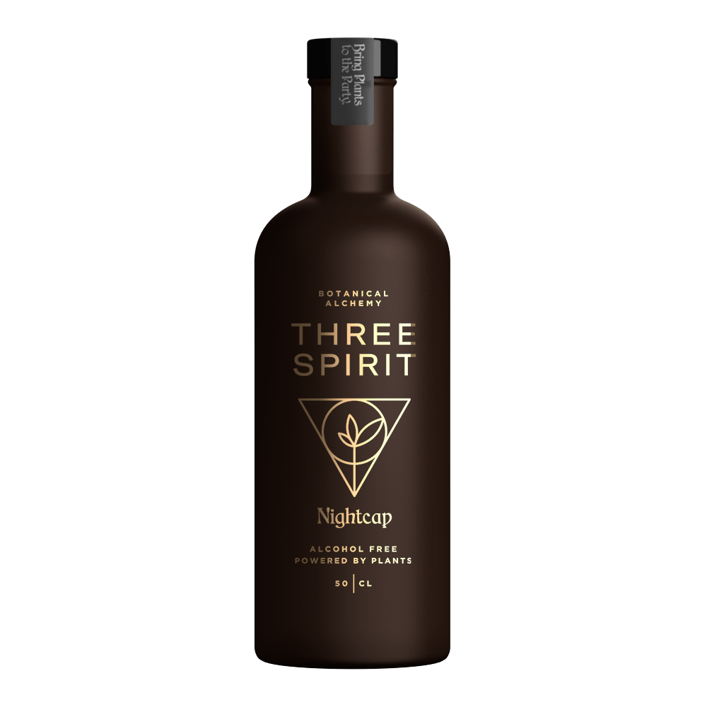 Bottle of Three Spirit Nightcap on a green background