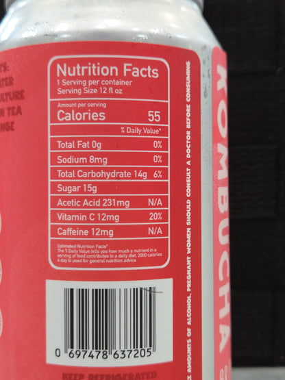 Nutrition facts label on a red can with a blurred background