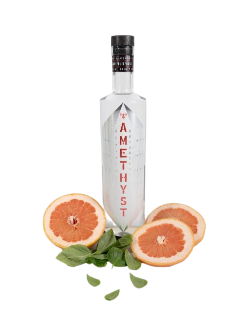 Bottle of Tamethyst with grapefruit slices and leaves on a white background