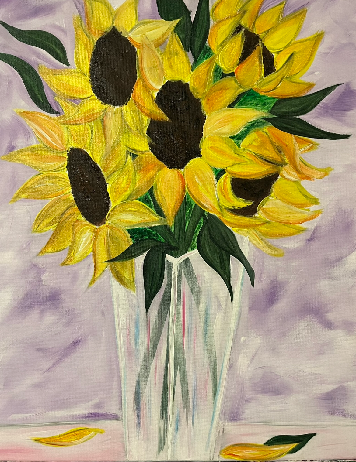 A painted still life of bright yellow sunflowers with dark brown centers and green leaves arranged in a clear glass vase against a soft lavender and purple background.