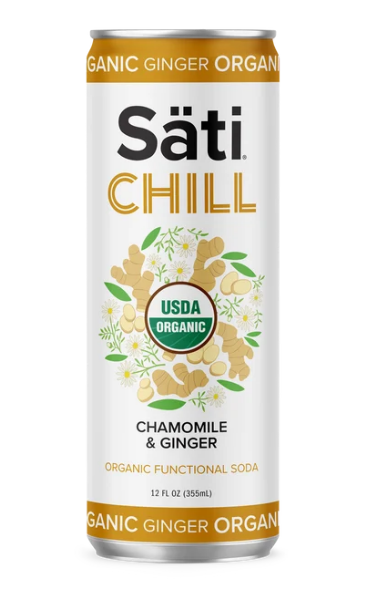 A 12 fl oz can of Säti Chill Chamomile & Ginger organic functional soda, featuring a white label with gold lettering, a USDA Organic seal, and illustrations of ginger roots and chamomile flowers.