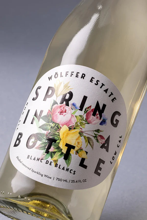 Wolffer Estate Spring Bottle wine bottle with floral label on a gray background